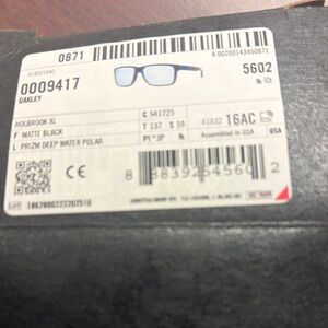 Brand new-never used. Oakley Matte Black Sunglasses with Blue Lenses-polarized